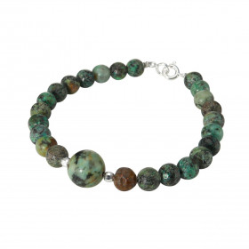 Bracelet Turquoise Africaine 6-10mm et Argent. Ce bracelet est composé de pierres de 6mm et d'une pierre de 10mm en son ce...