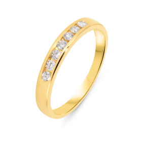 Demi alliance Or Jaune 750 sertie 7 diamants 2mm diamètre Poids total diamant : 0.25 carat Qualité Diamant : G Si Largeur ...