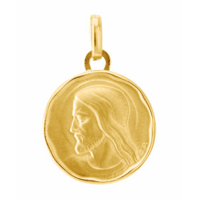 Médaille Christ en Or jaune 750/1000.. Plaque ronde diamètre 15mm.. Effet satiné sur les deux faces.. 