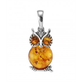 Pendentif en argent en forme de hibou avec une ambre de 10mm de diamètre et 2 petites ambres pour les yeux. Ambre de coule...