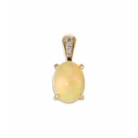 Pendentif Or Jaune 750 Opale Ovale 9x7mm et diamants. Opale ovale de 9x7mm (1 carat). Bélière sertie de 3 diamants pour un...