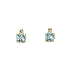 Puces d'oreilles Or Jaune 750 Topazes bleues traitées Rondes 4mm et Oxydes de zirconium. Chaque boucle est sertie d'une To...